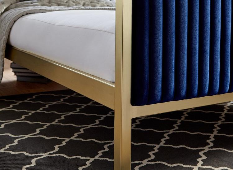 metallic gold edging on navy blue material bed frame