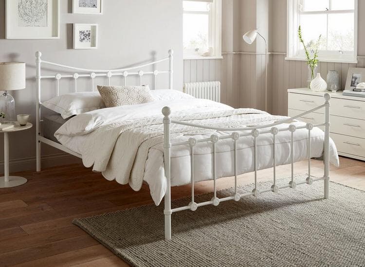 Ava metal bed frame in white placed in a white bedroom
