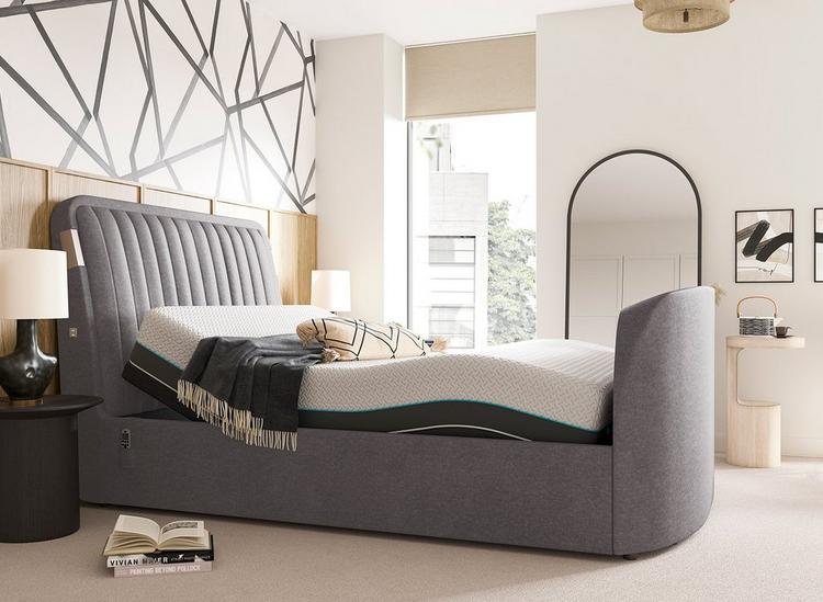 Silver velvet TV bed, styled against statement monochrome wallpaper, with an adjustable Sleepmotion bed base