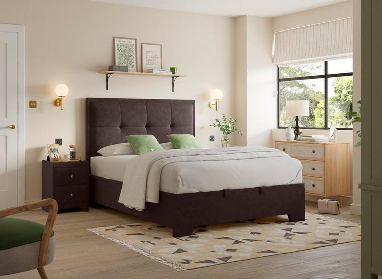 A mid-tone brown bed in woven fabric, styled in a neutral cream bedroom