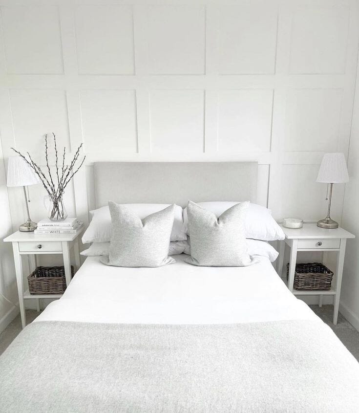 Grey headboard on white panelling