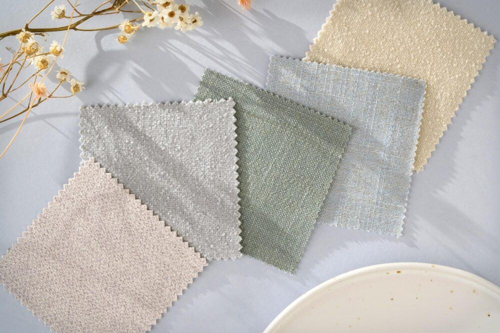 Moodboard of pale pastel fabric swatches