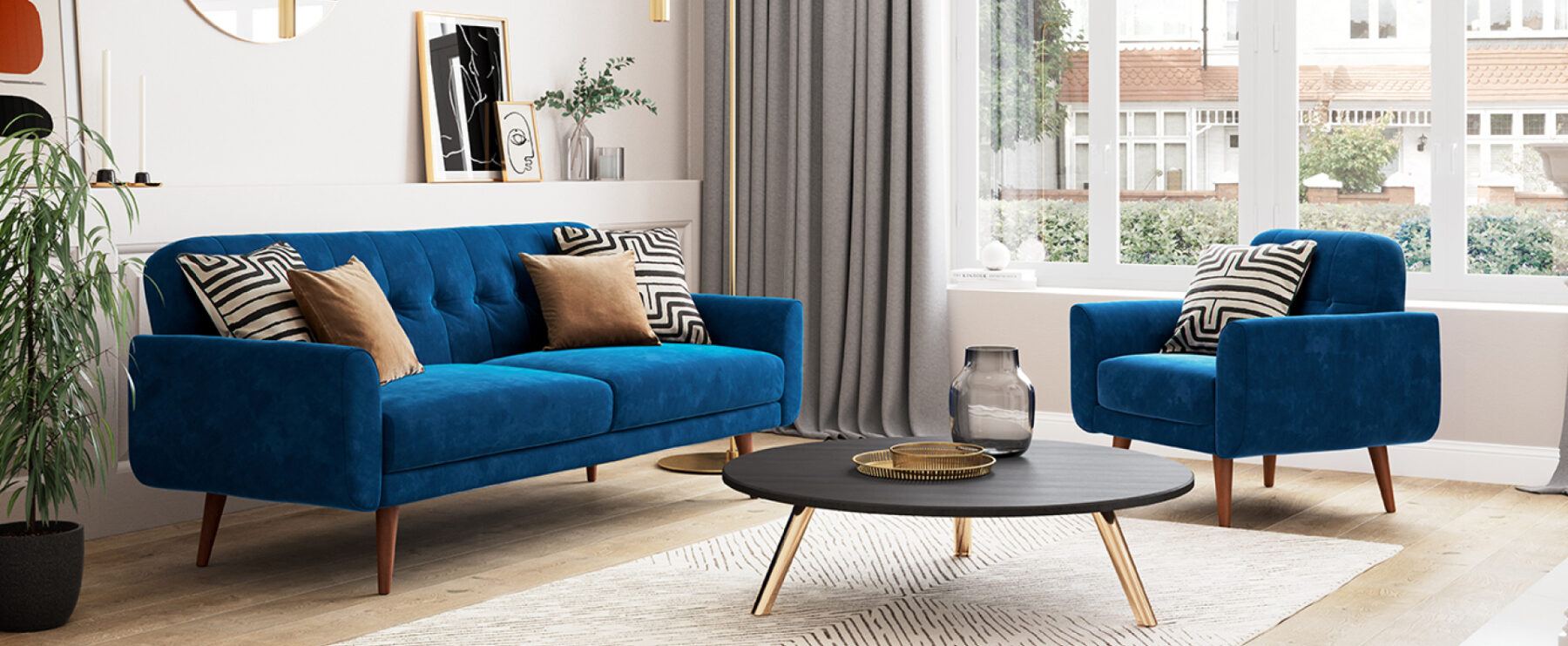 Living room space with blue velvet sofa and chair