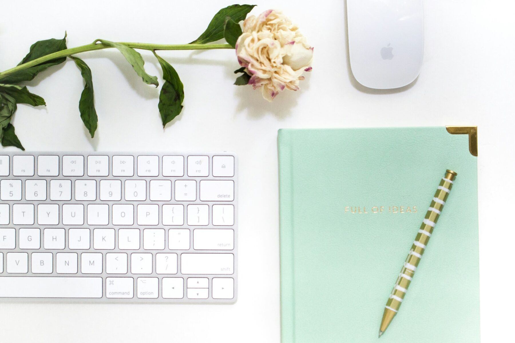 Office desk with keyboard and notebook