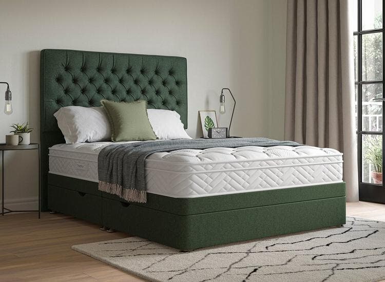 A dark green ottoman bed with an ornate, neo-classic buttoned headboard in a modern, laid-back bedroom.