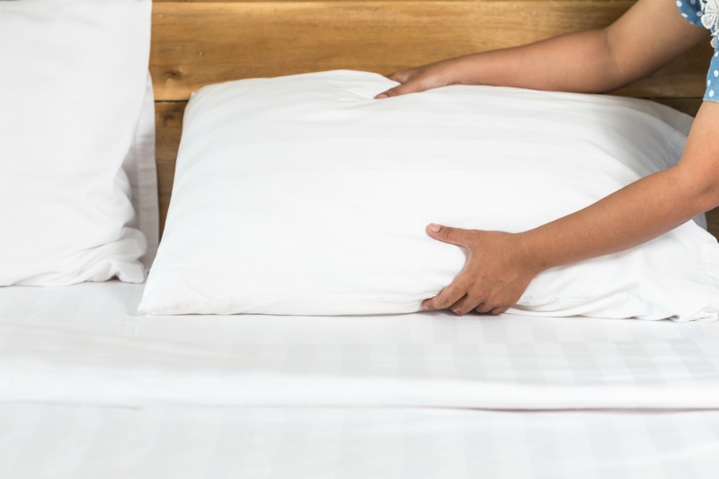 Image of person changing pillow