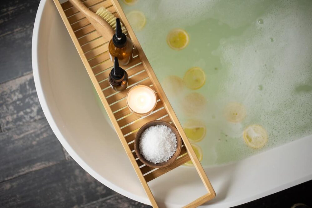 Close-up of hot bath with bath salts and lemon slices