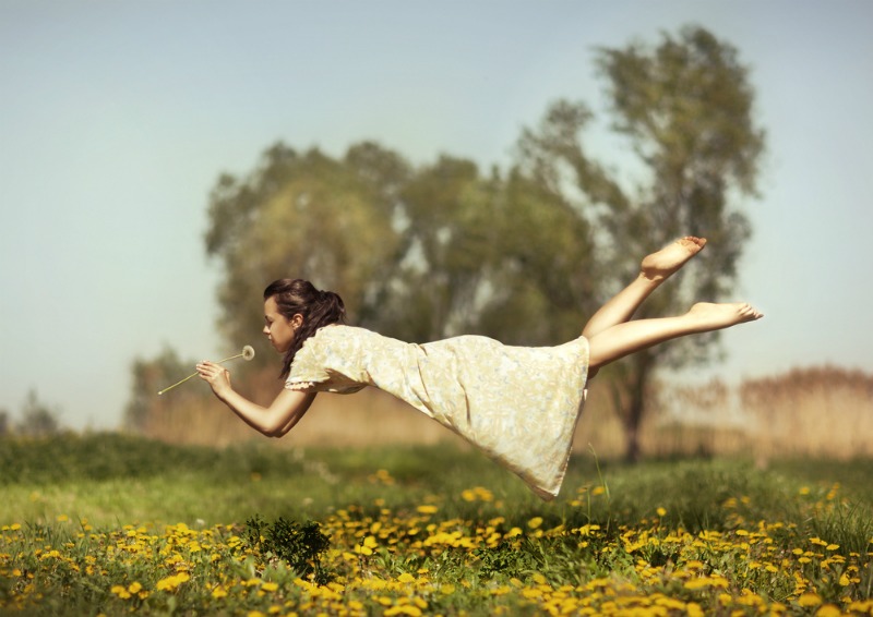 Image of woman dreaming of scents of flowers