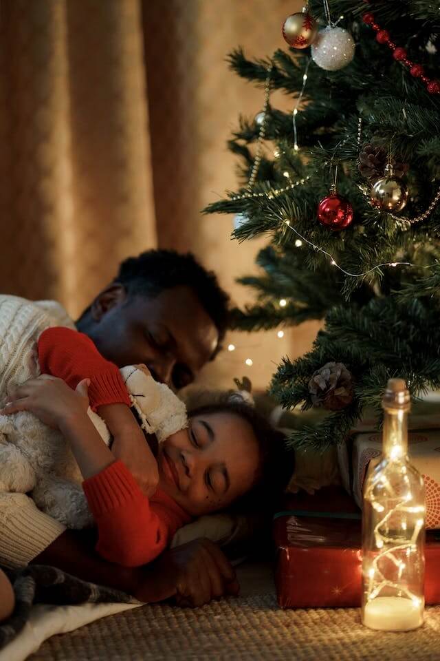Father and daughter sleeping on Christmas Eve