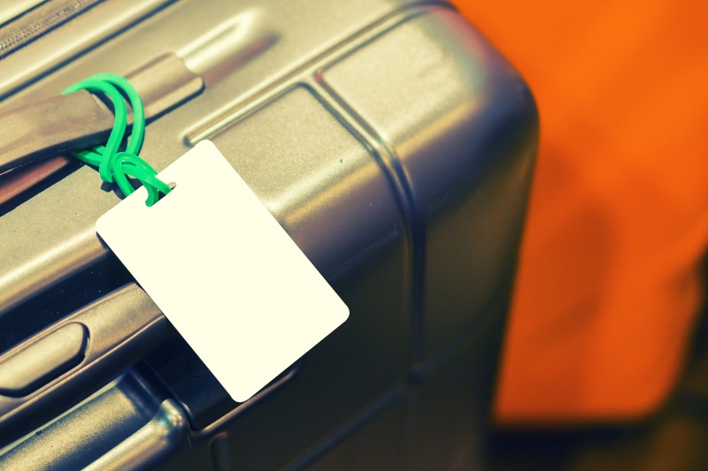 An image of luggage with a luggage tag