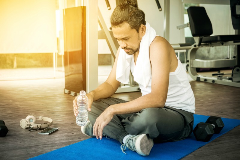 Image of man with extreme tiredness at the gym