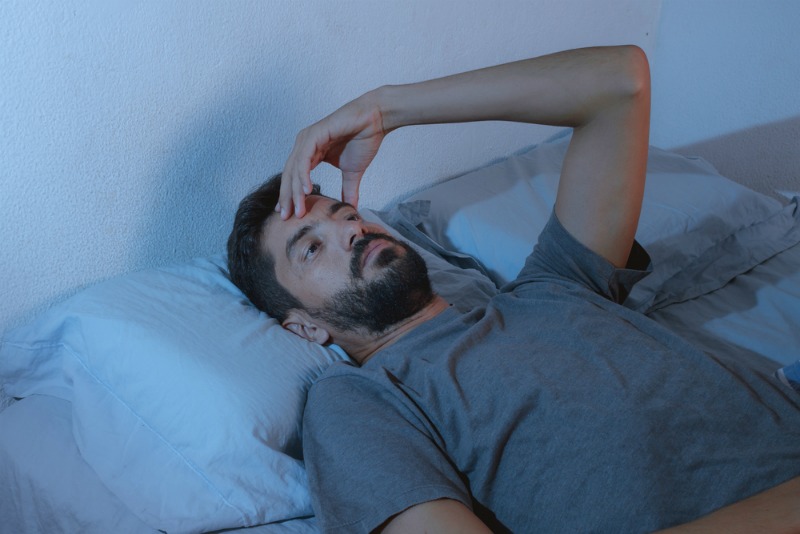 image of man unable to sleep 