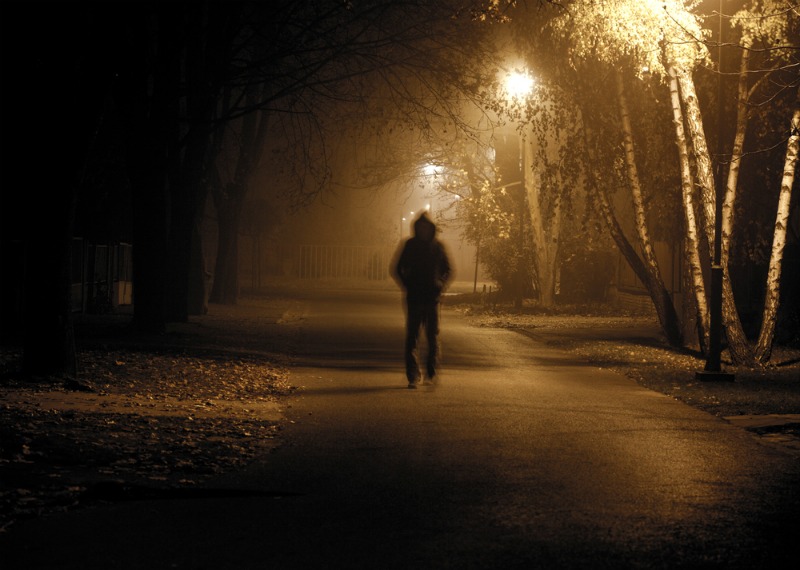 image of a scary man walking alone