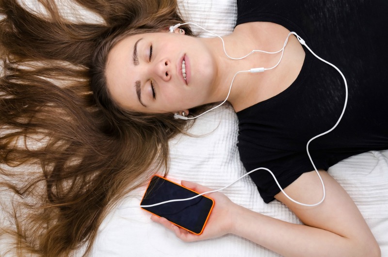 Image of sleeping with earphones