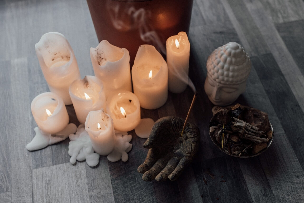 Spiritual setup with candles and Buddha
