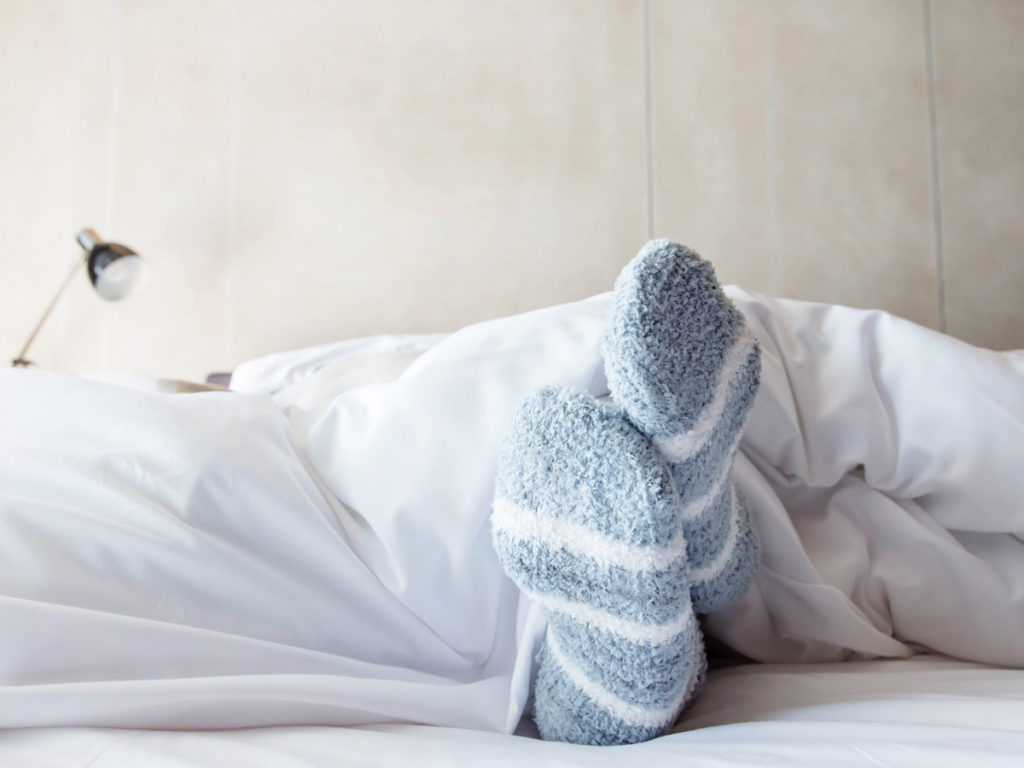 Wearing Socks To Bed: Does It Help You Sleep Better?