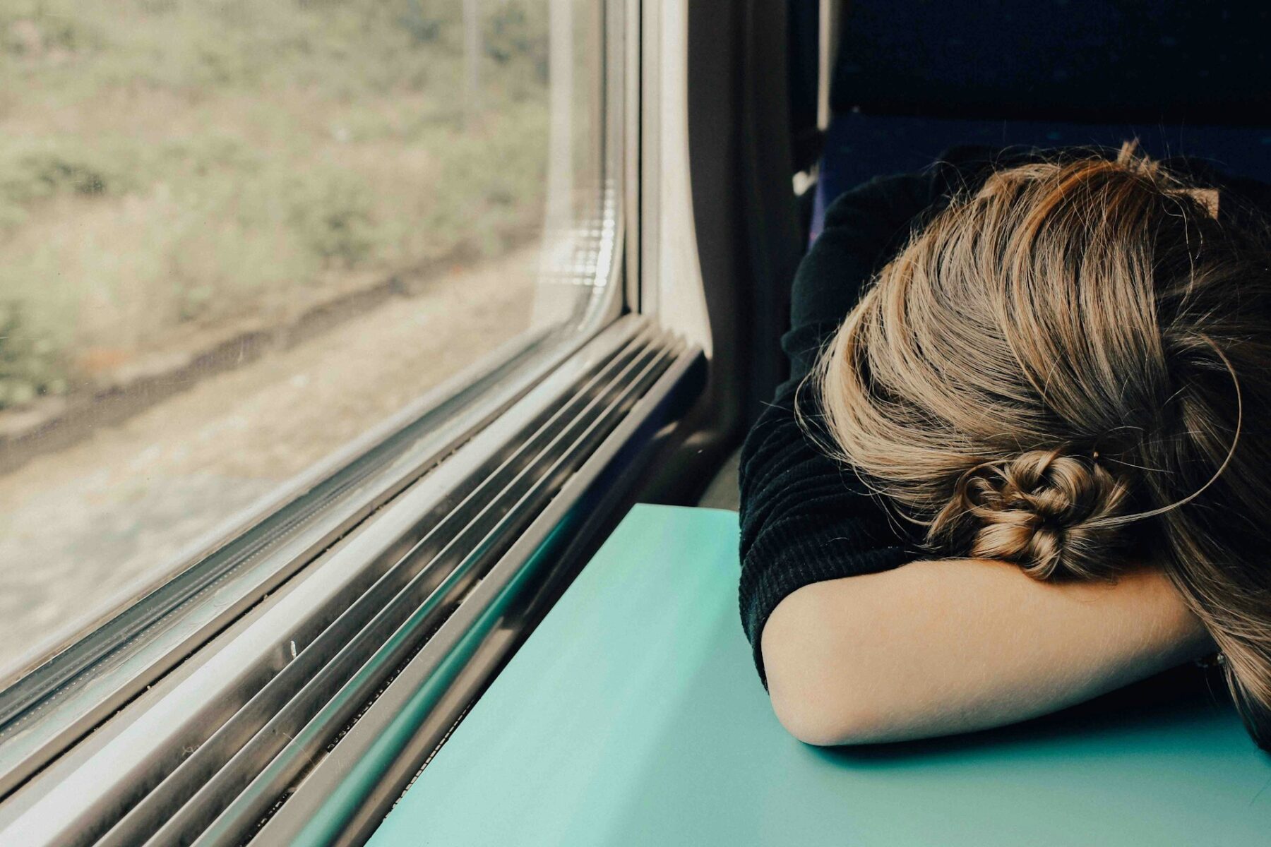 Woman asleep on train