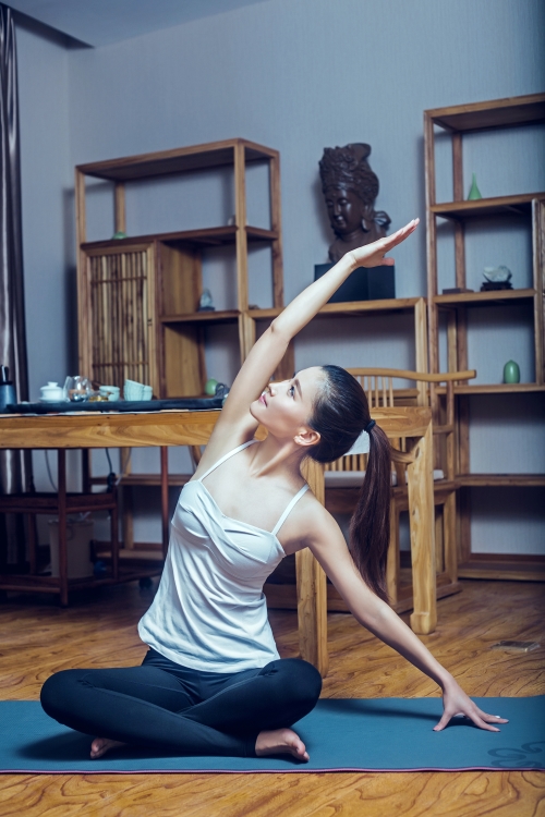 woman stretching for bed