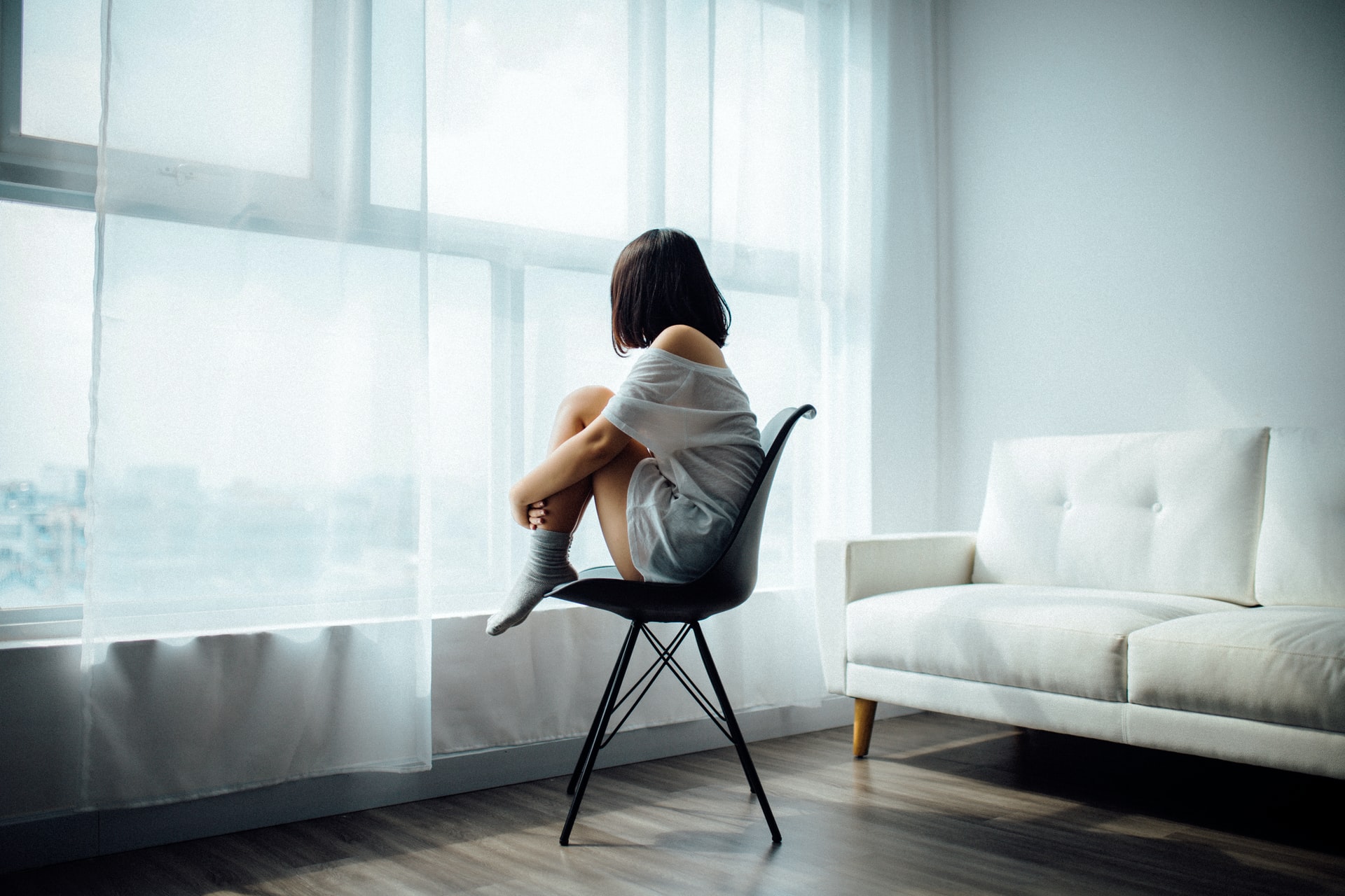 Girl sitting on a chair alone