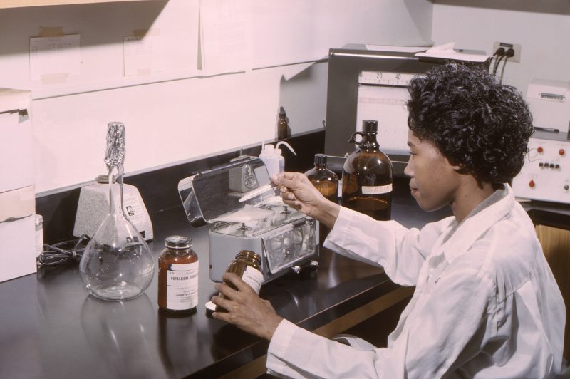 image of scientist in laboratory looking at CBD for sleep