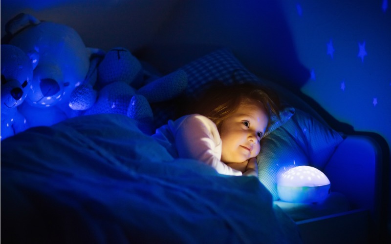 Child with night light