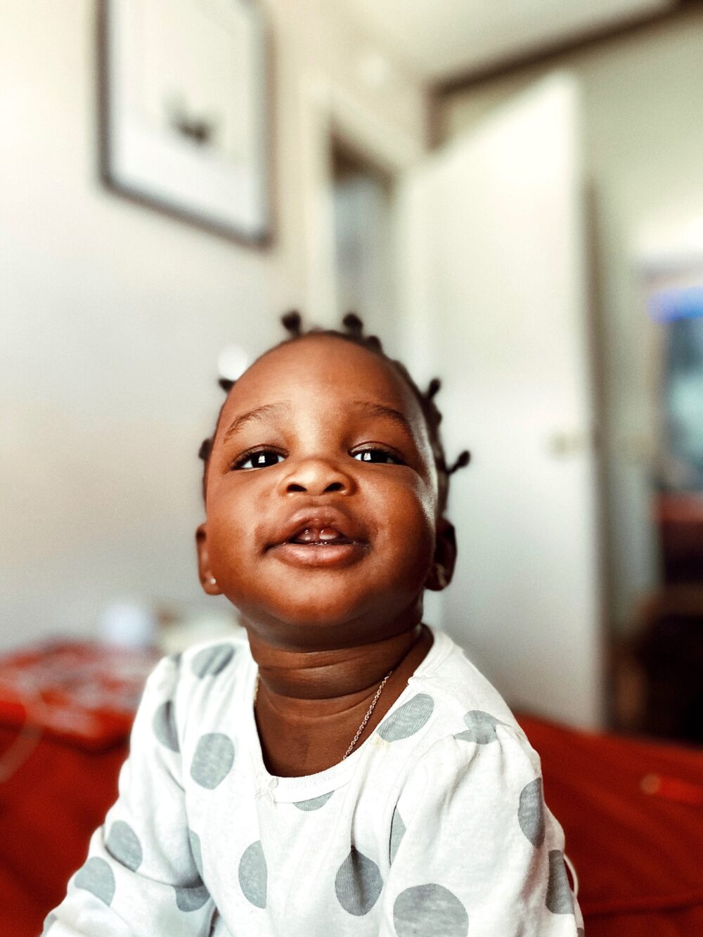 Baby with growing tooth