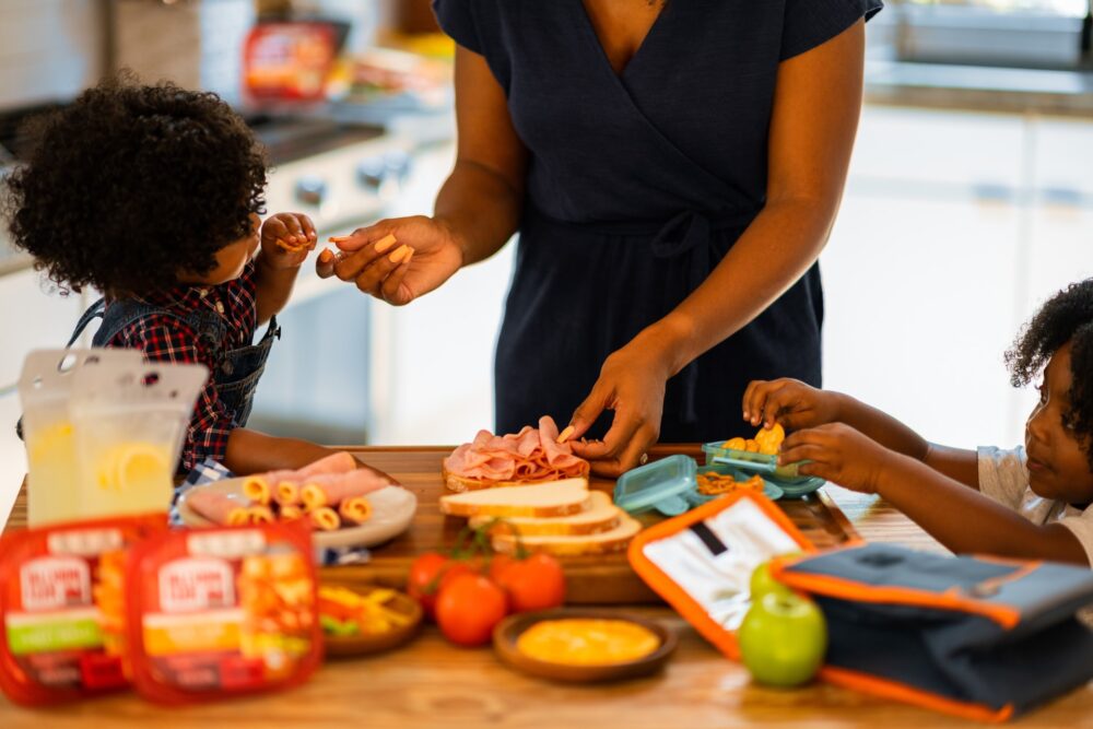 Mum packing lunch with kids