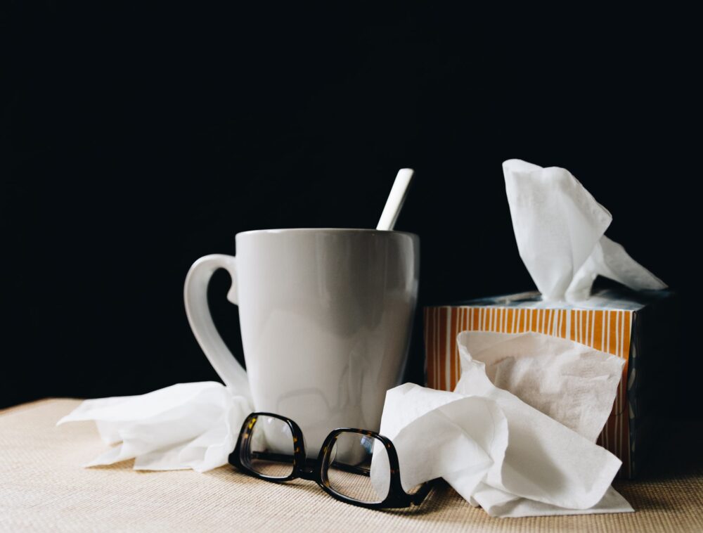 tissues with mug and glasses