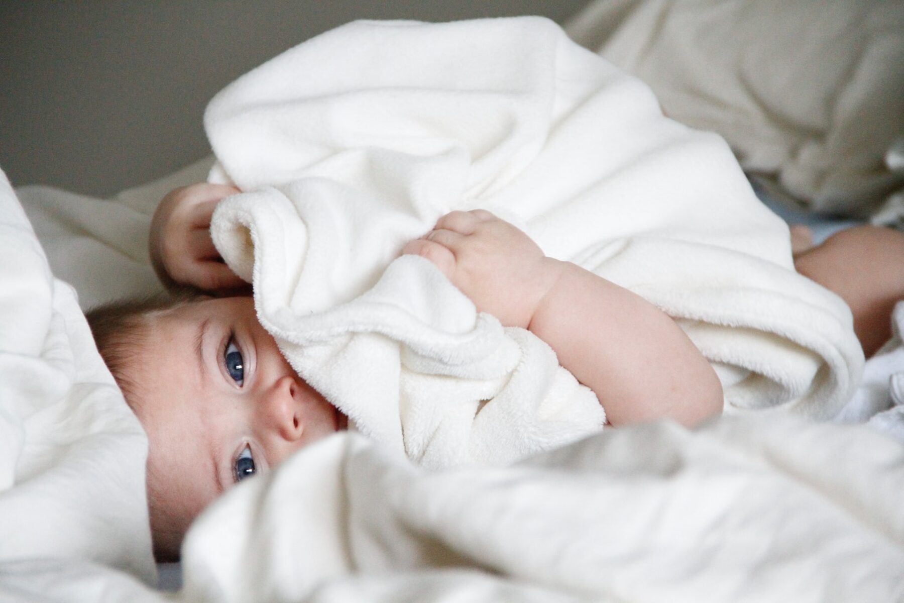 baby lying in bed