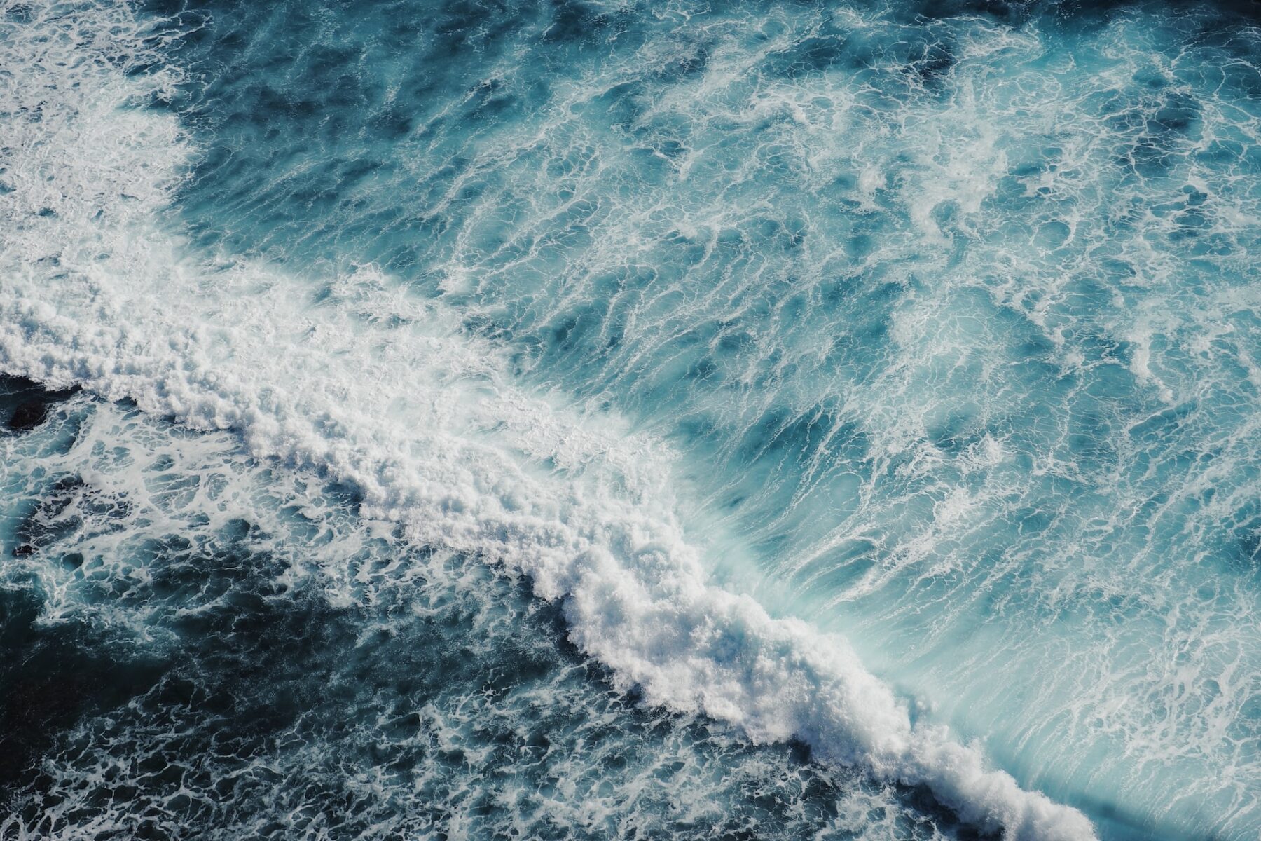 birds eye view of a stormy, lively ocean.