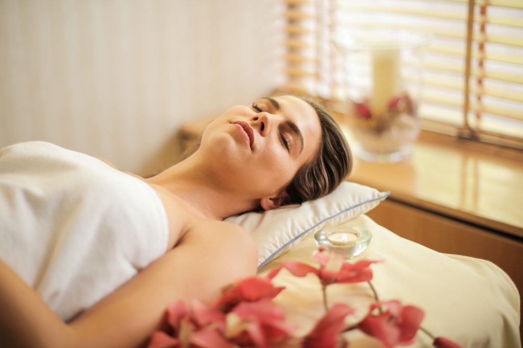 Image of woman relaxing to show relaxing as a sleep goal