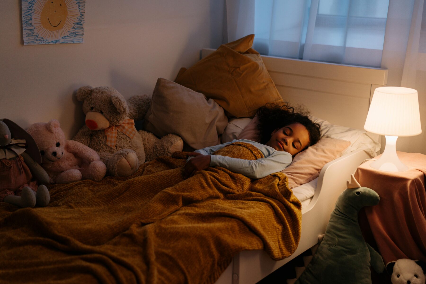 Little girl sleeping peacefully in bed