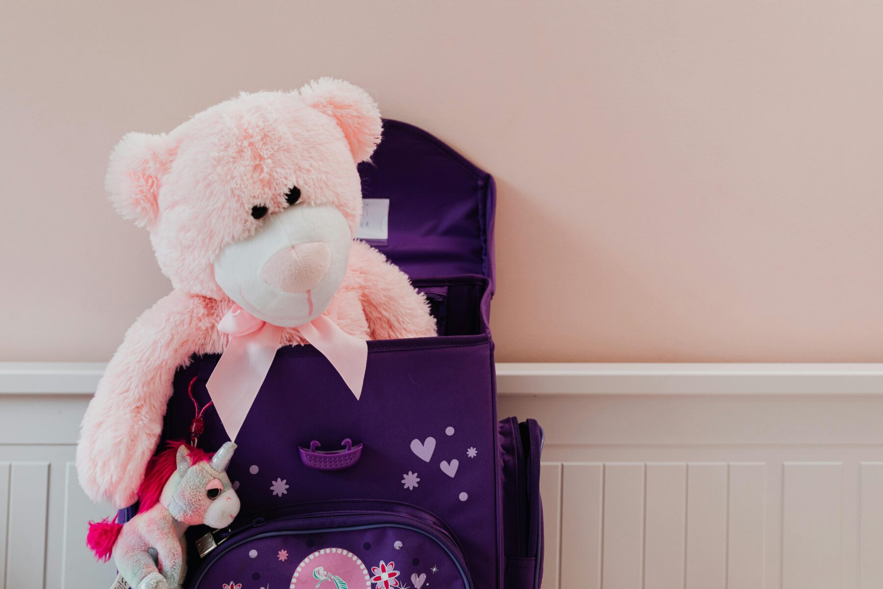 Purple backpack with pink teddy bear