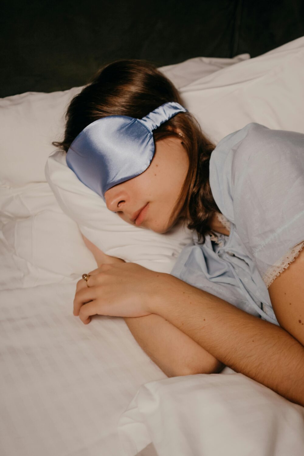 Woman napping with beauty mask.