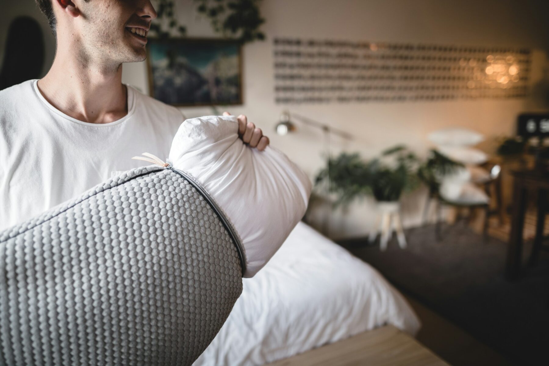 Man taking pillow case off