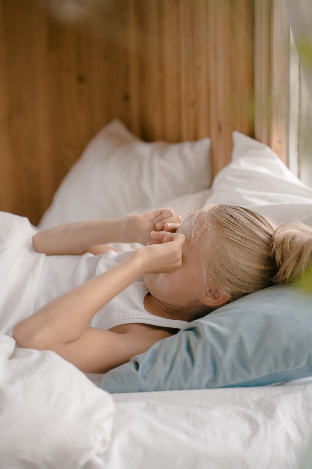 Young girl rubbing her eyes
