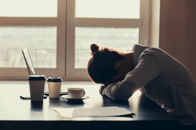 An image of a tired woman demonstrating chronic fatigue