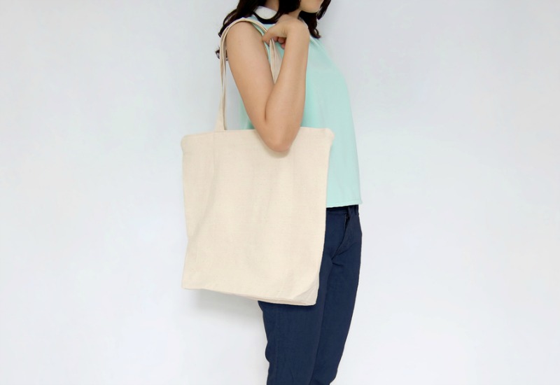 Woman holding tote bag