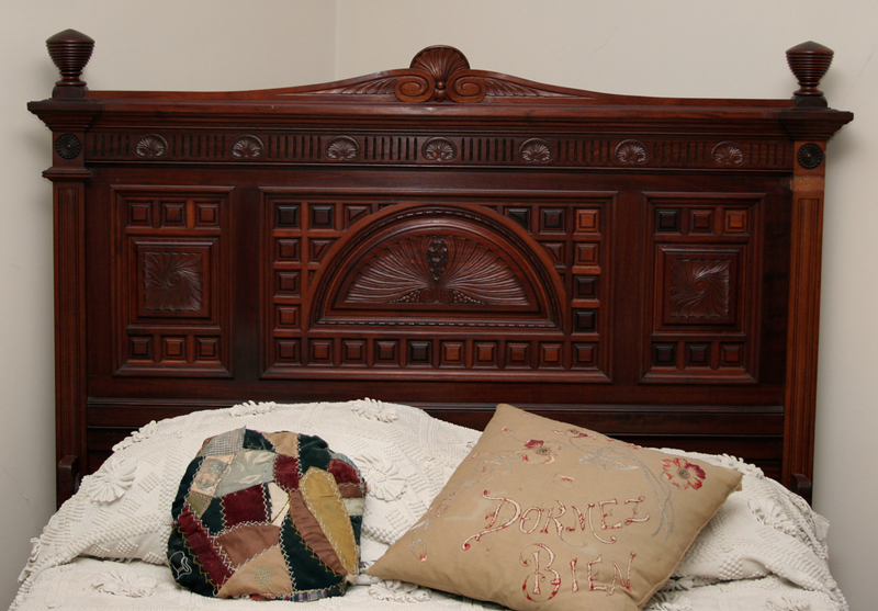 Elabourately carved wooden victorian-style headboards