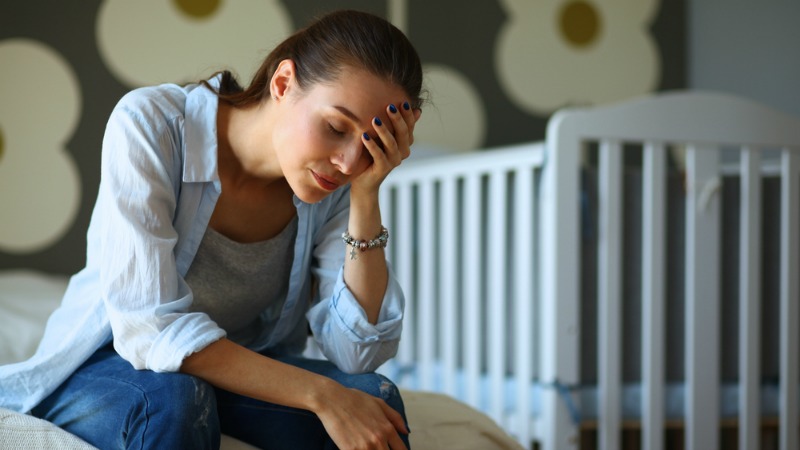 Woman tired on bed