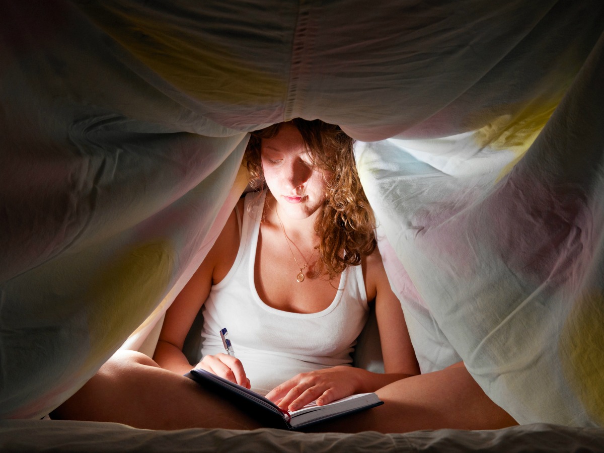 Woman writing in journal