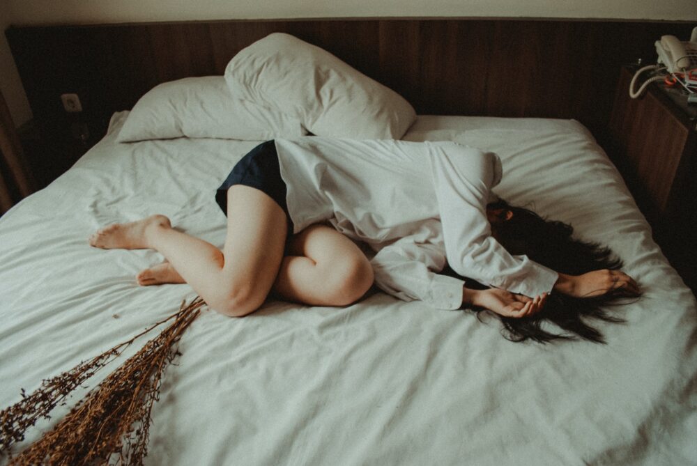 Woman in bed snoozing